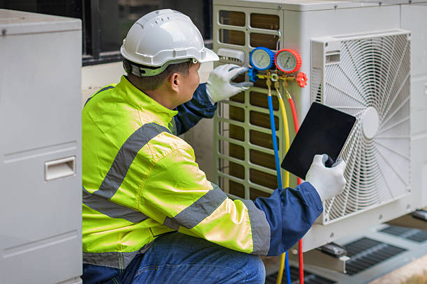 Professional Heat Pump Repair technician working in Geneva, AL
